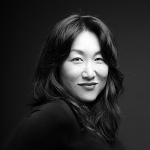 Hannah Sung A black and white photo of Hannah look at the camera.